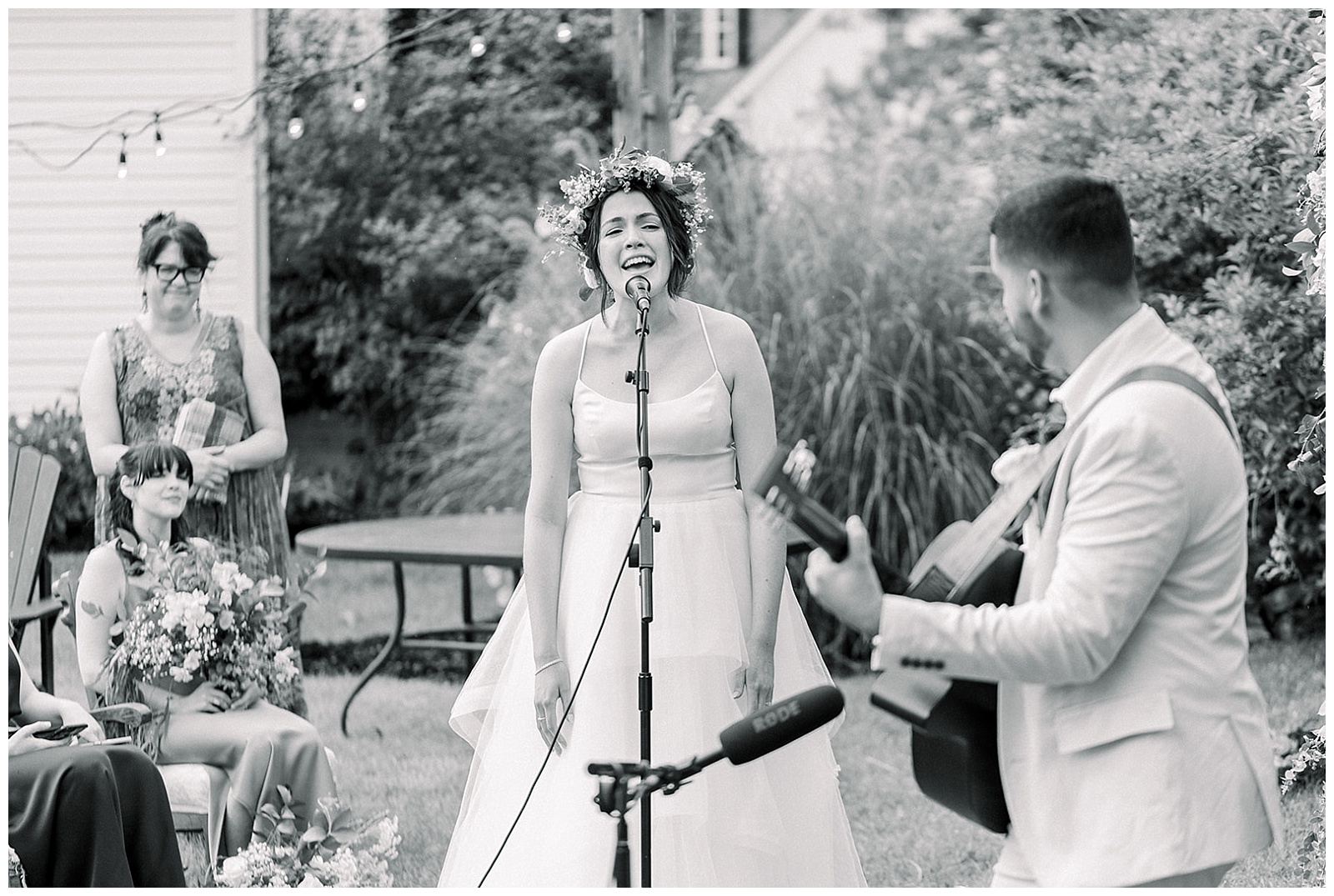 newlywed couple sing an emotional song during their intimate home wedding ceremony