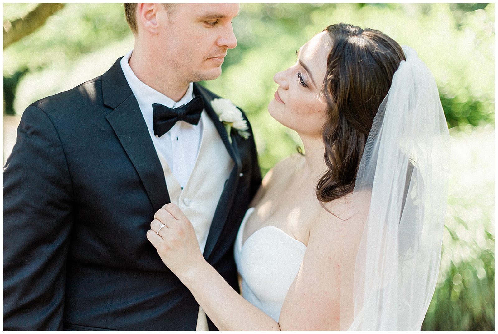 close up portrait of bride and groom looking at each other during their wedding at belle voir manor in bensalem pa