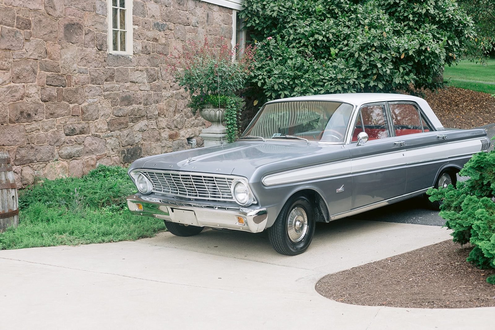 classic ford car used as getaway car at end of wedding reception