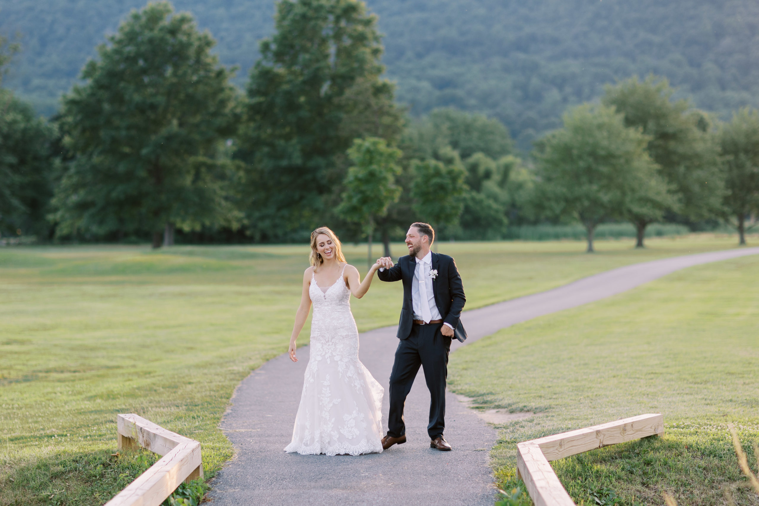 Married couple walking on golf course path at Liberty Mountain Resort