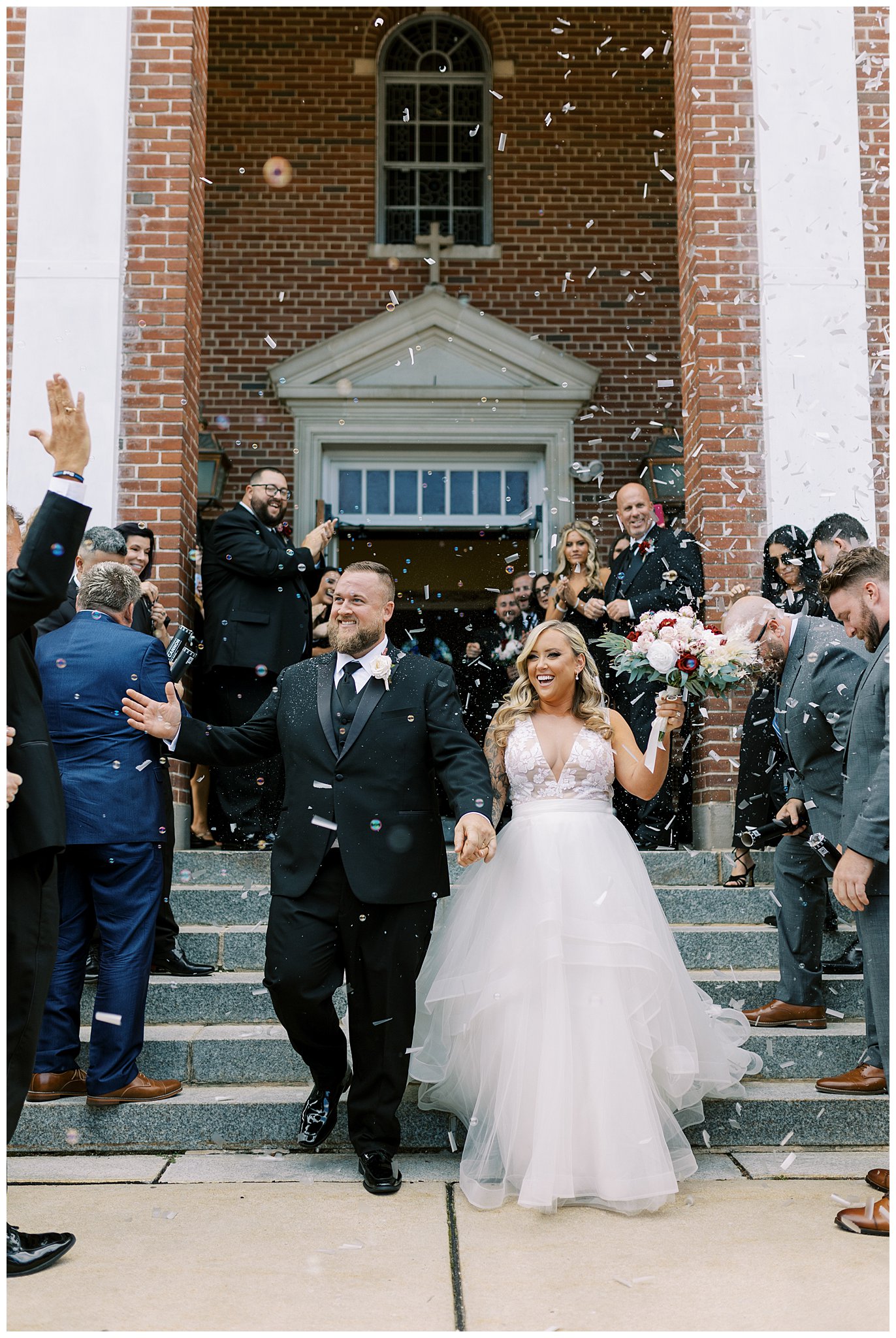 Confetti Pops as couple walks outside of church after wedding ceremony